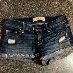 Low rise dark wash jean shorts.